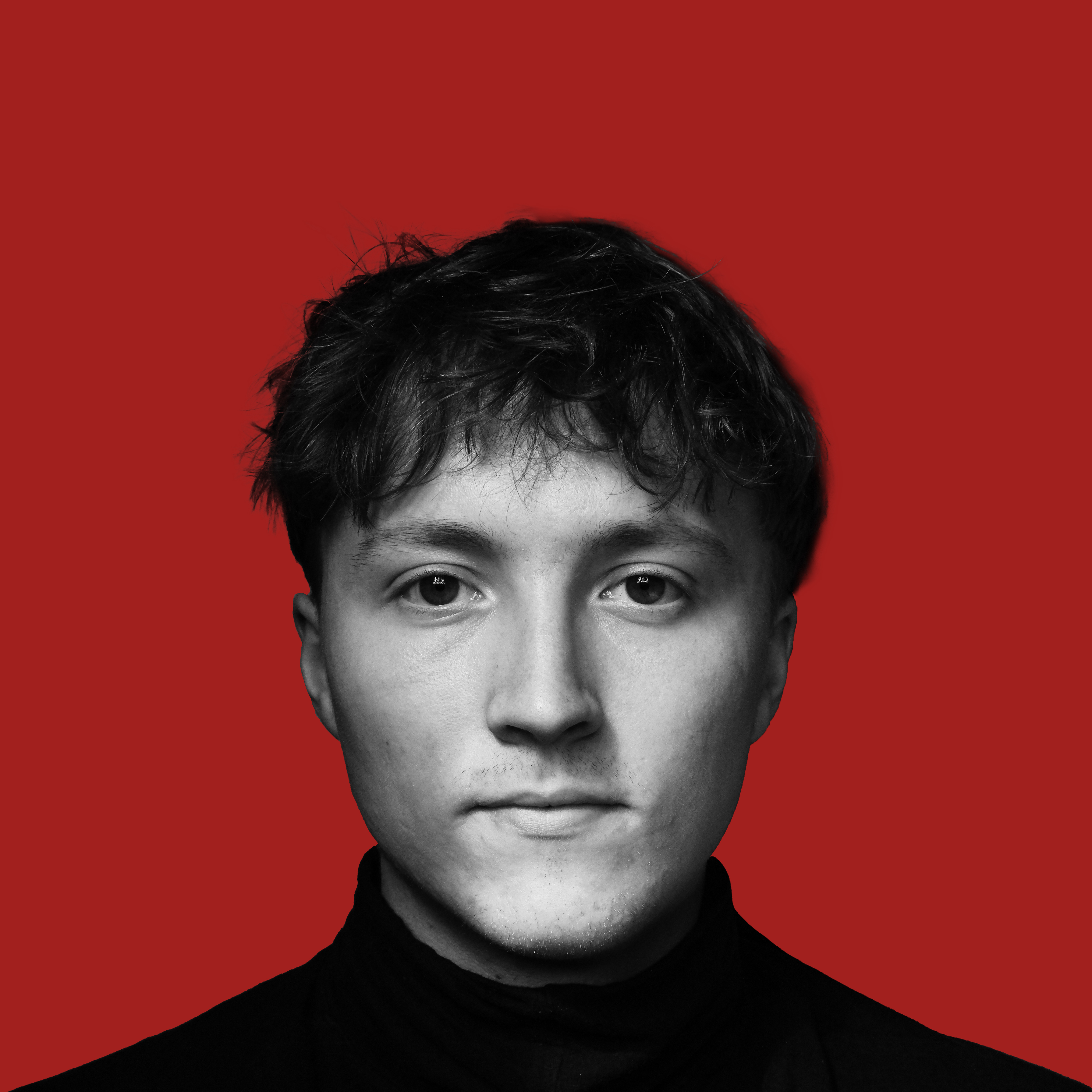 Portrait of Dominik Procházka against a red background
